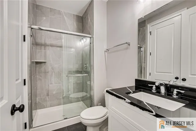 a view of entryway with wooden floor and windows