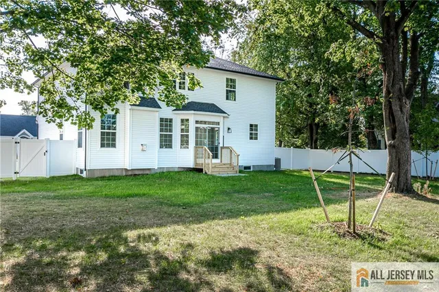 a view of yard with grass and trees