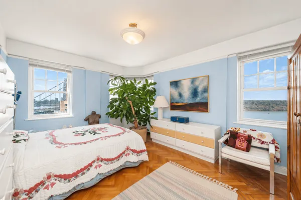 a bedroom with a bed and a table