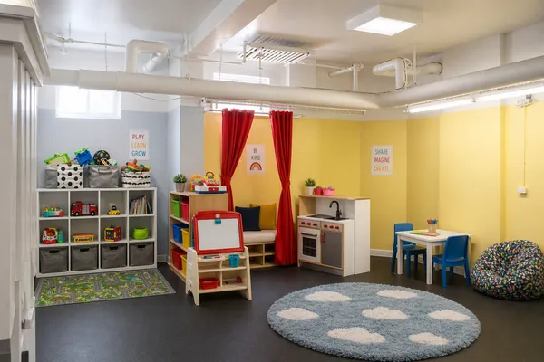 a room with lots of furniture and white walls