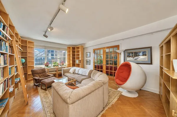 a living room with furniture and a table
