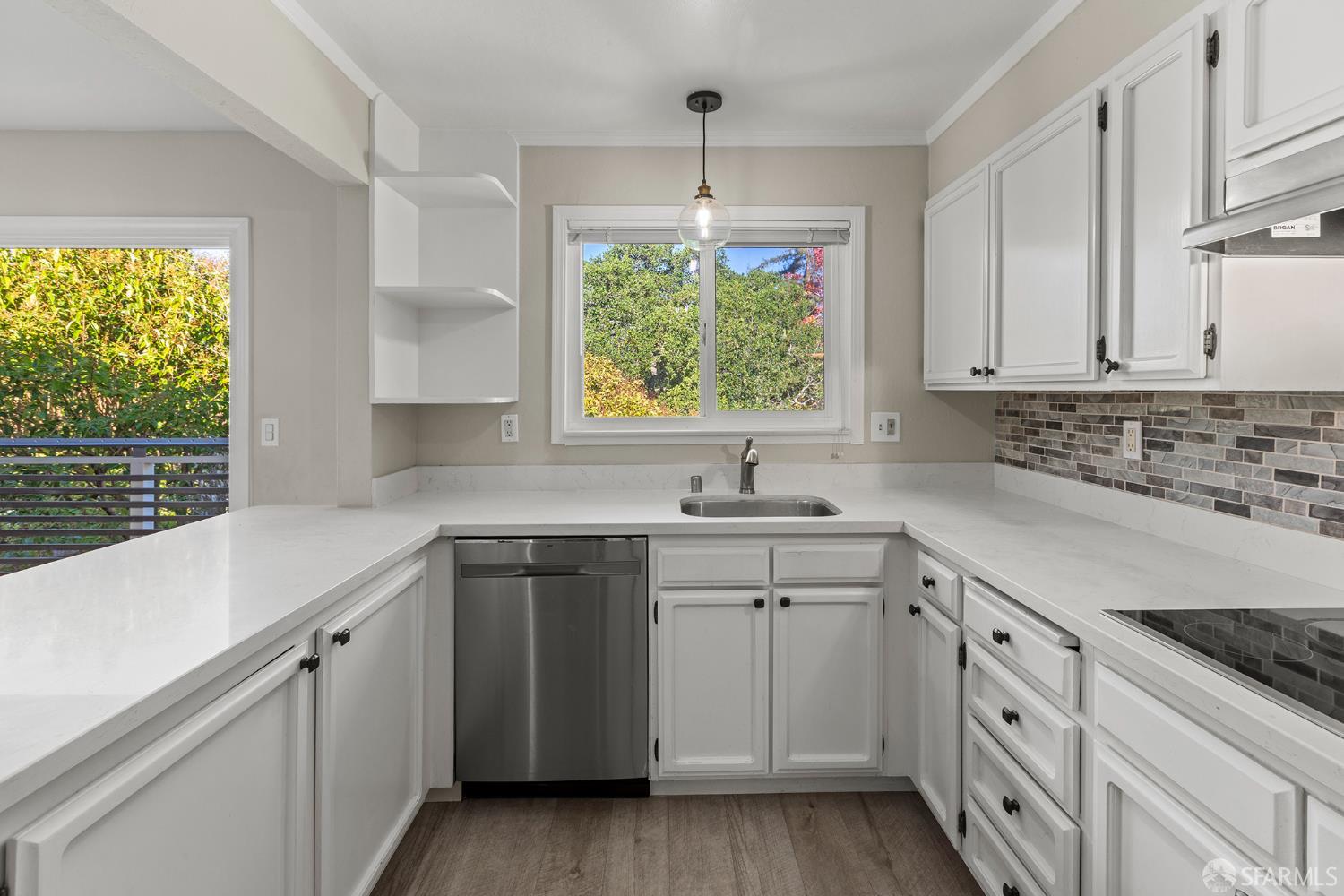 1059 El Centro Avenue, Unit 3 Oakland, CA 94602 - Photo 11 of 25 a kitchen with a sink stove and cabinets