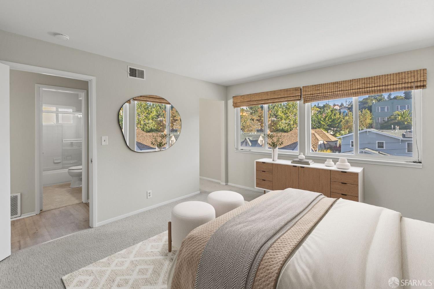 1059 El Centro Avenue, Unit 3 Oakland, CA 94602 - Photo 14 of 25 a bedroom with a large bed and a large window