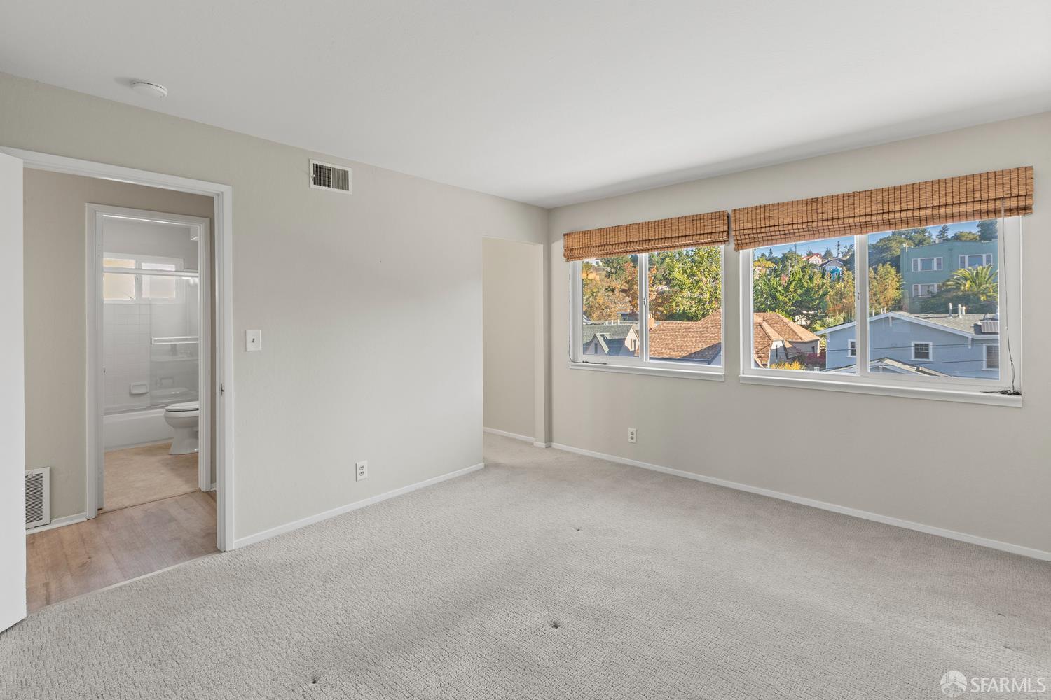 1059 El Centro Avenue, Unit 3 Oakland, CA 94602 - Photo 15 of 25 an empty room with windows lake and mountain view