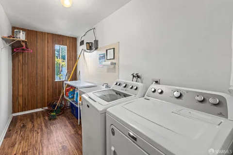 a view of storage and utility room with washer and dryer
