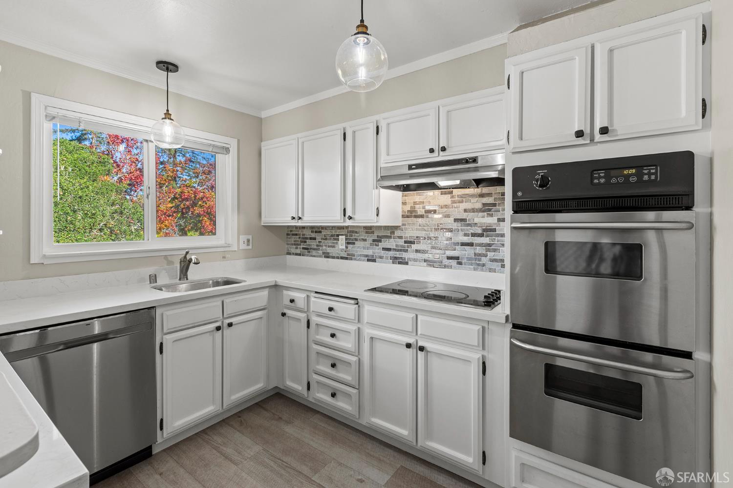 1059 El Centro Avenue, Unit 3 Oakland, CA 94602 - Photo 10 of 25 a kitchen with appliances cabinets and a sink