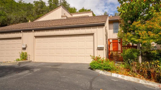 a small white house with a outdoor space