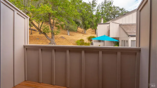 a view of balcony with two chairs