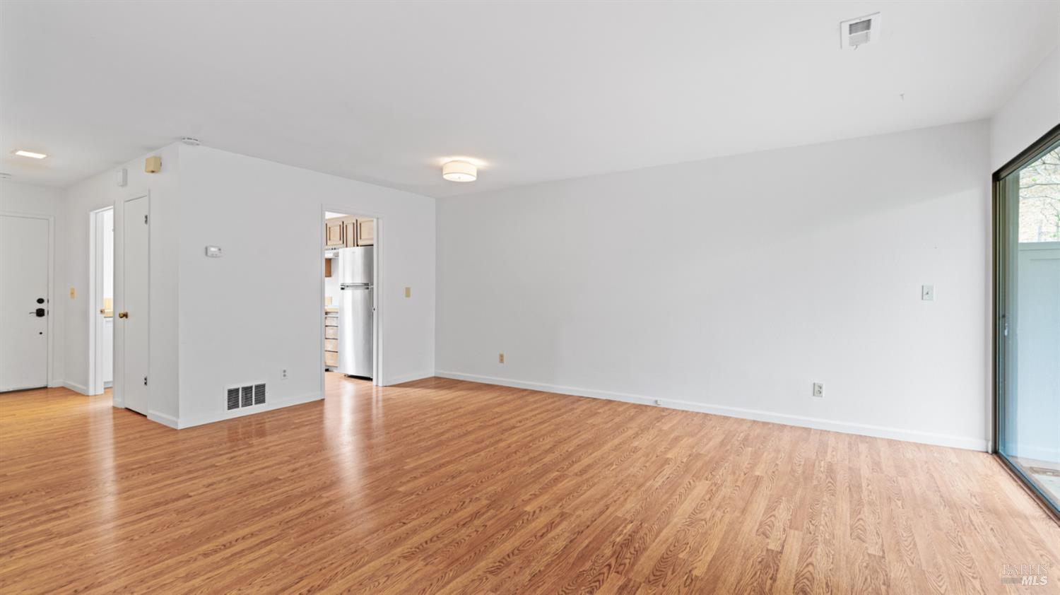 19 Burdell Court Novato, CA 94949 - Photo 27 of 30 a view of an empty room with wooden floor