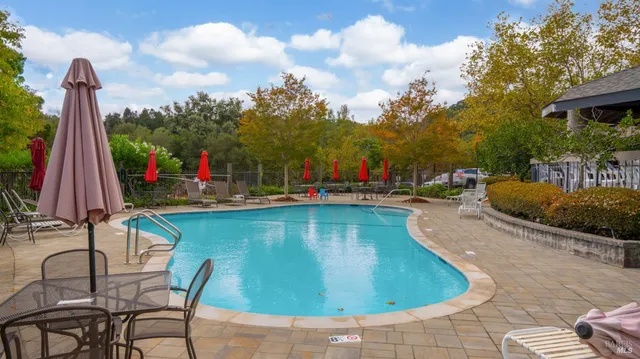 a view of a swimming pool with a lounge chairs