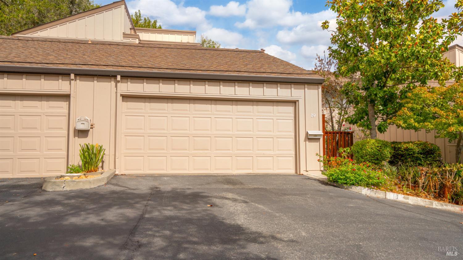 19 Burdell Court Novato, CA 94949 - Photo 30 of 30 a front view of a house with a yard and garage