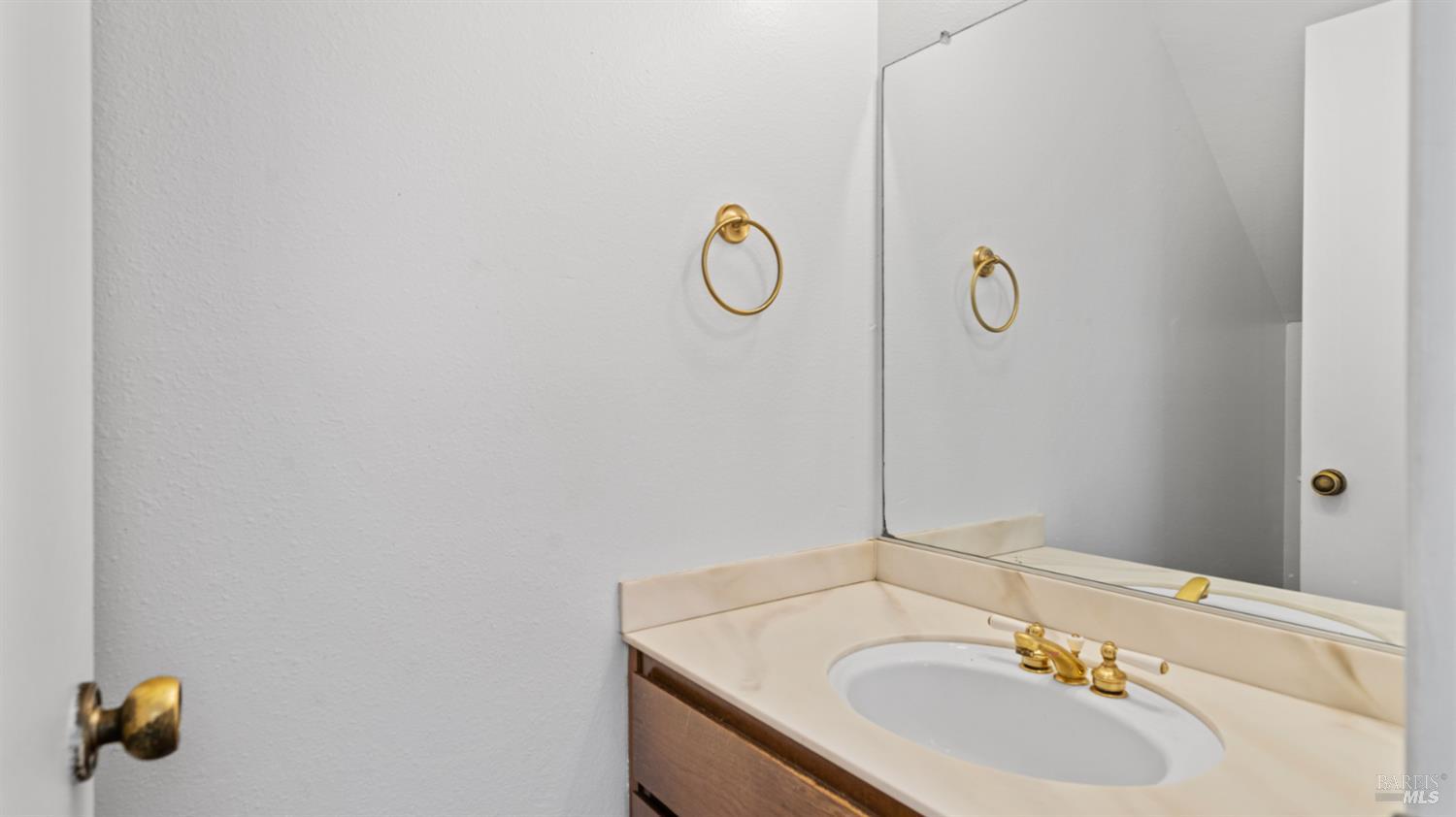 19 Burdell Court Novato, CA 94949 - Photo 10 of 30 a bathroom with a sink and a mirror