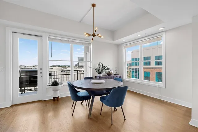 a view of a dining room with furniture window and wooden floor