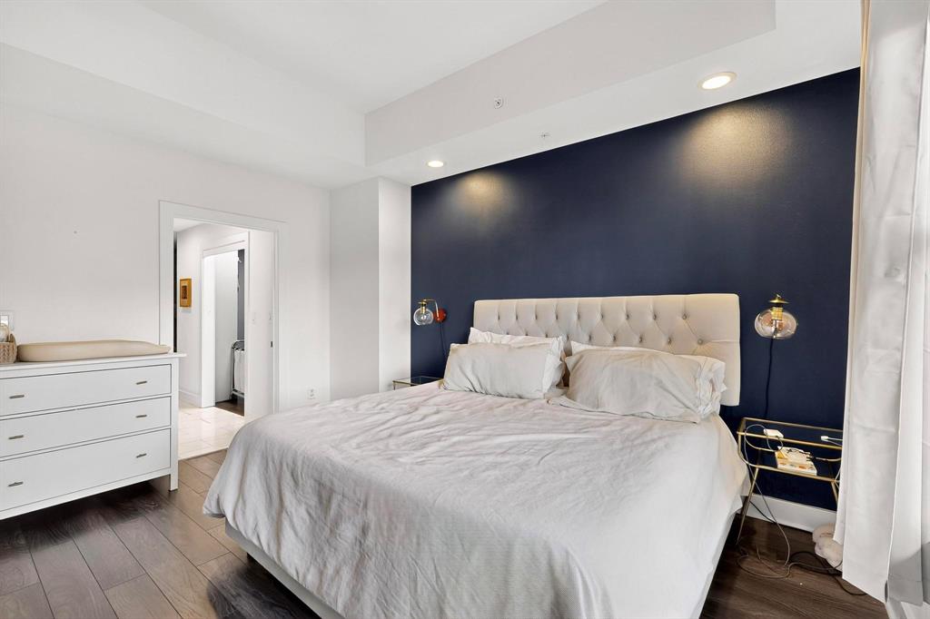 5055 Addison Circle, Unit 736 Addison, TX 75001 - Photo 18 of 34 a bedroom with a bed and a flat screen tv