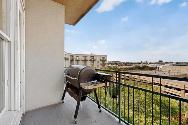a view of balcony with furniture