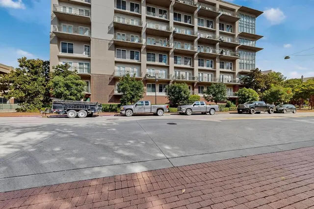 a building exterior with building and bench