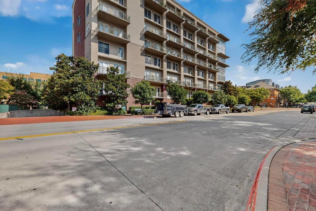 5055 Addison Circle, Unit 736 Addison, TX 75001 - Photo 30 of 34 a view of tall buildings and a street