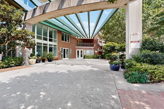 a front view of a building with garden