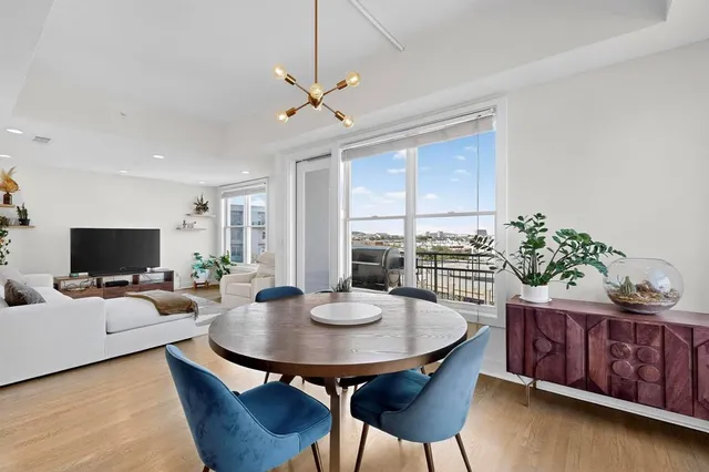 a view of a dining room with furniture and a livingroom