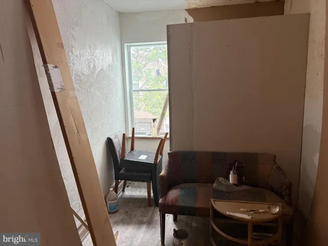 a view of a room with furniture window and wooden floor