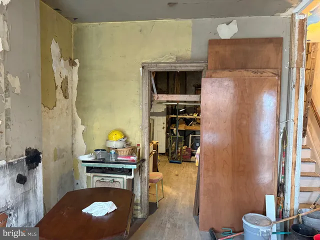 a kitchen with a refrigerator and a stove