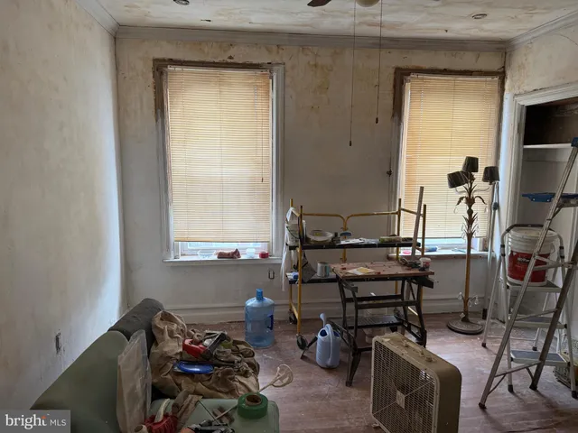 a room with gym equipment and a window