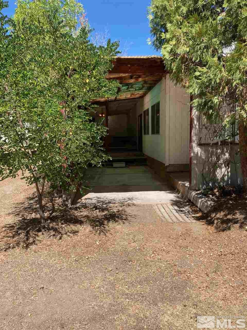 968 Gear Street Reno, NV 89503 - Photo 8 of 19 a front view of a house with a yard