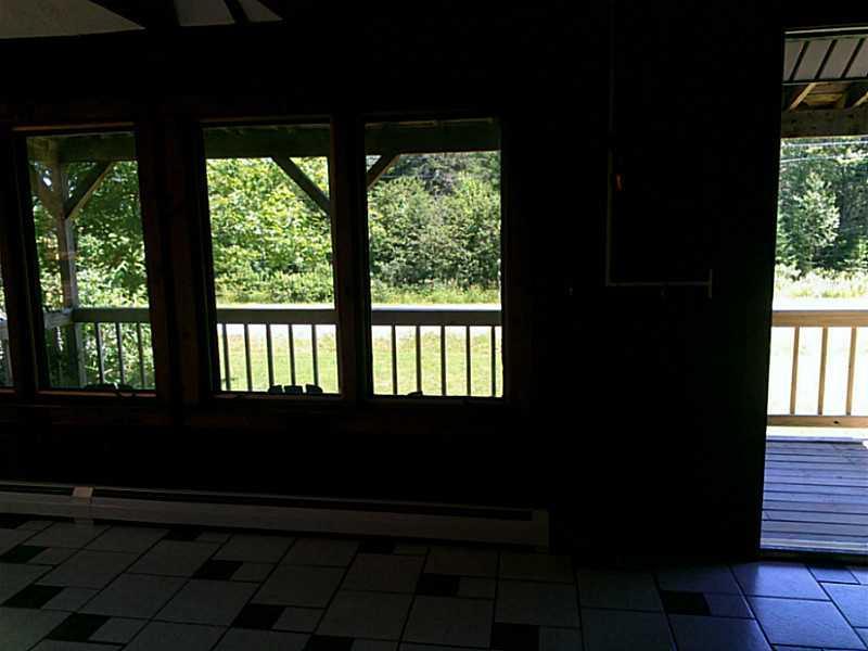 505 Oak Point Road Trenton, ME 04605 - Photo 15 of 29 Living Room. From tiled living room...