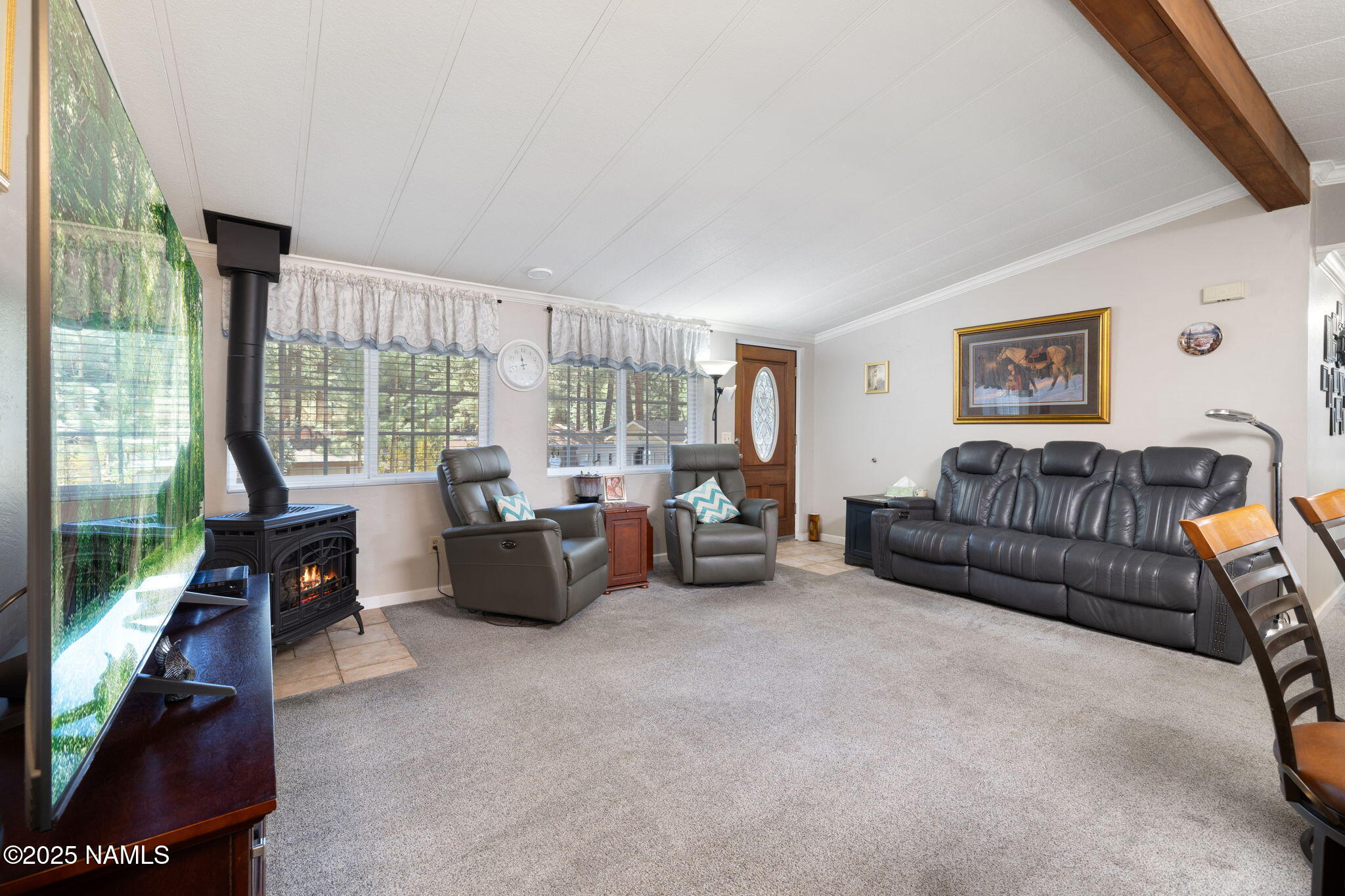 2401 West Rte 66 Flagstaff, AZ 86001 - Photo 18 of 47 a living room with furniture and a flat screen tv