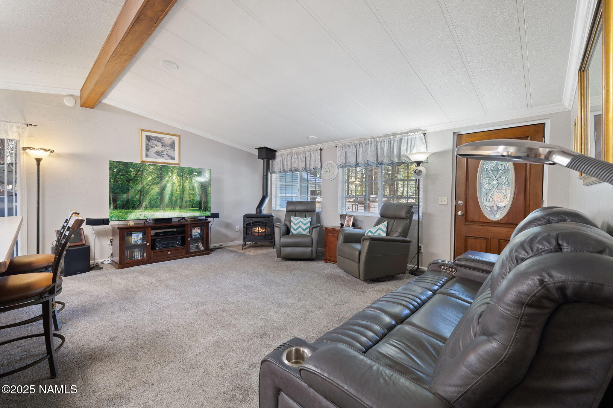 2401 West Rte 66 Flagstaff, AZ 86001 - Photo 19 of 47 a living room with furniture and a flat screen tv