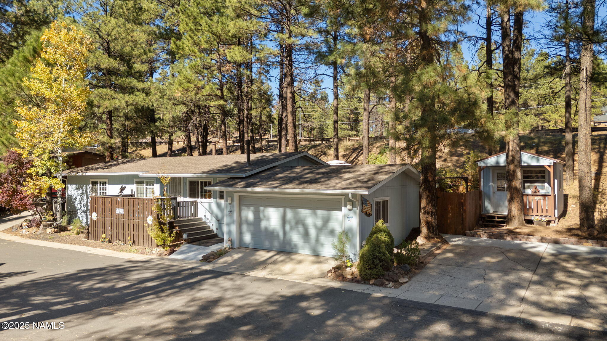 2401 West Rte 66 Flagstaff, AZ 86001 - Photo 2 of 47 a view of a town with large trees and a barn