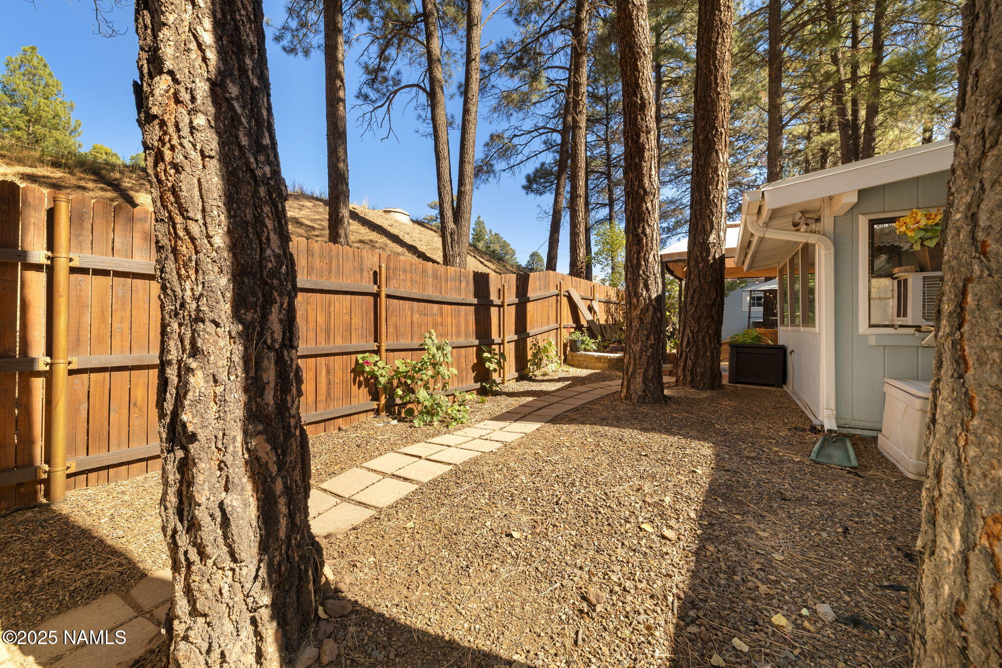 2401 West Rte 66 Flagstaff, AZ 86001 - Photo 32 of 47 a view of a backyard with wooden fence