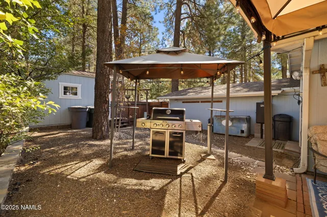 a view of a chairs and table in the patio