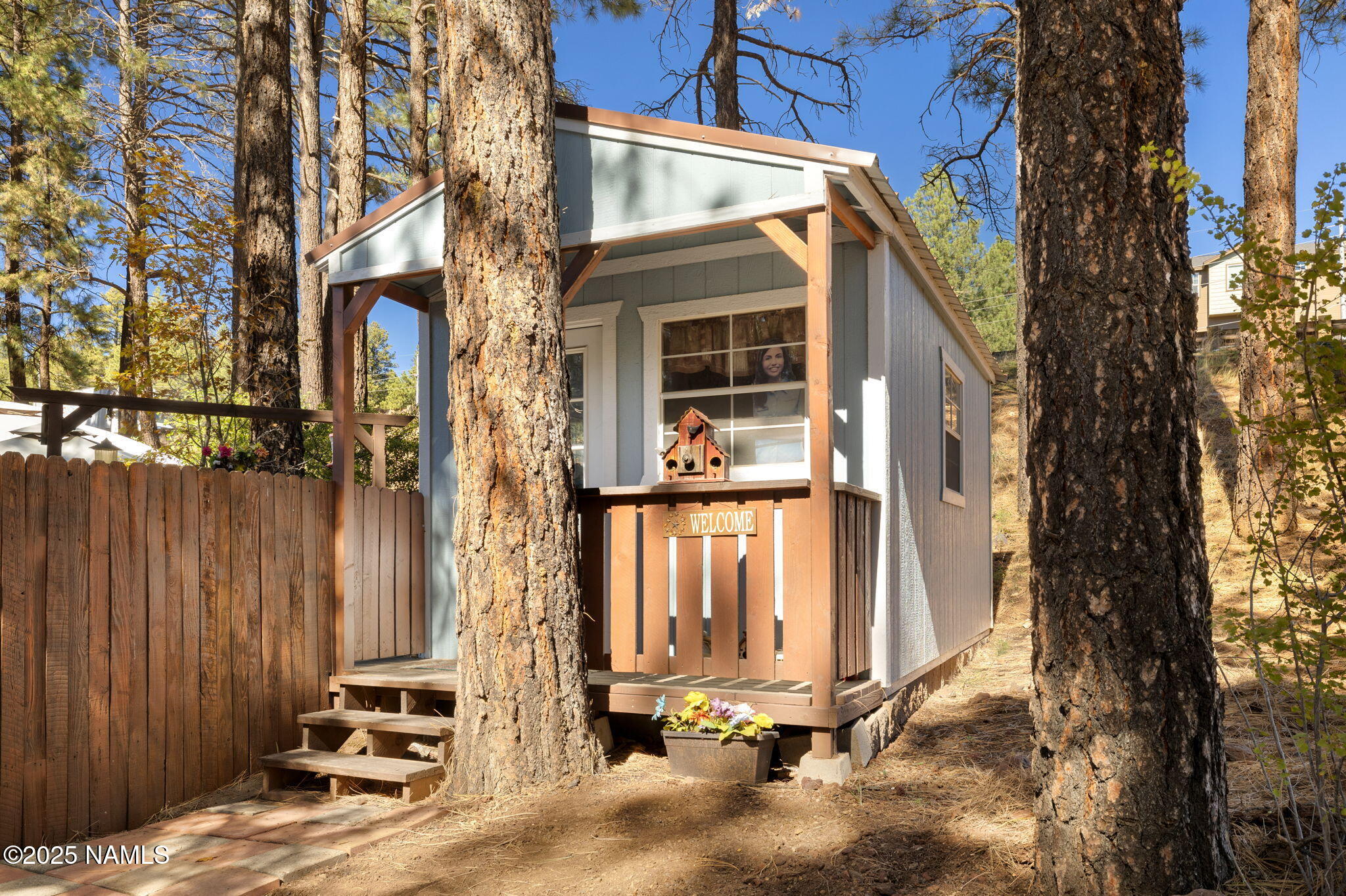 2401 West Rte 66 Flagstaff, AZ 86001 - Photo 38 of 47 a view of a house with a door and wooden fence