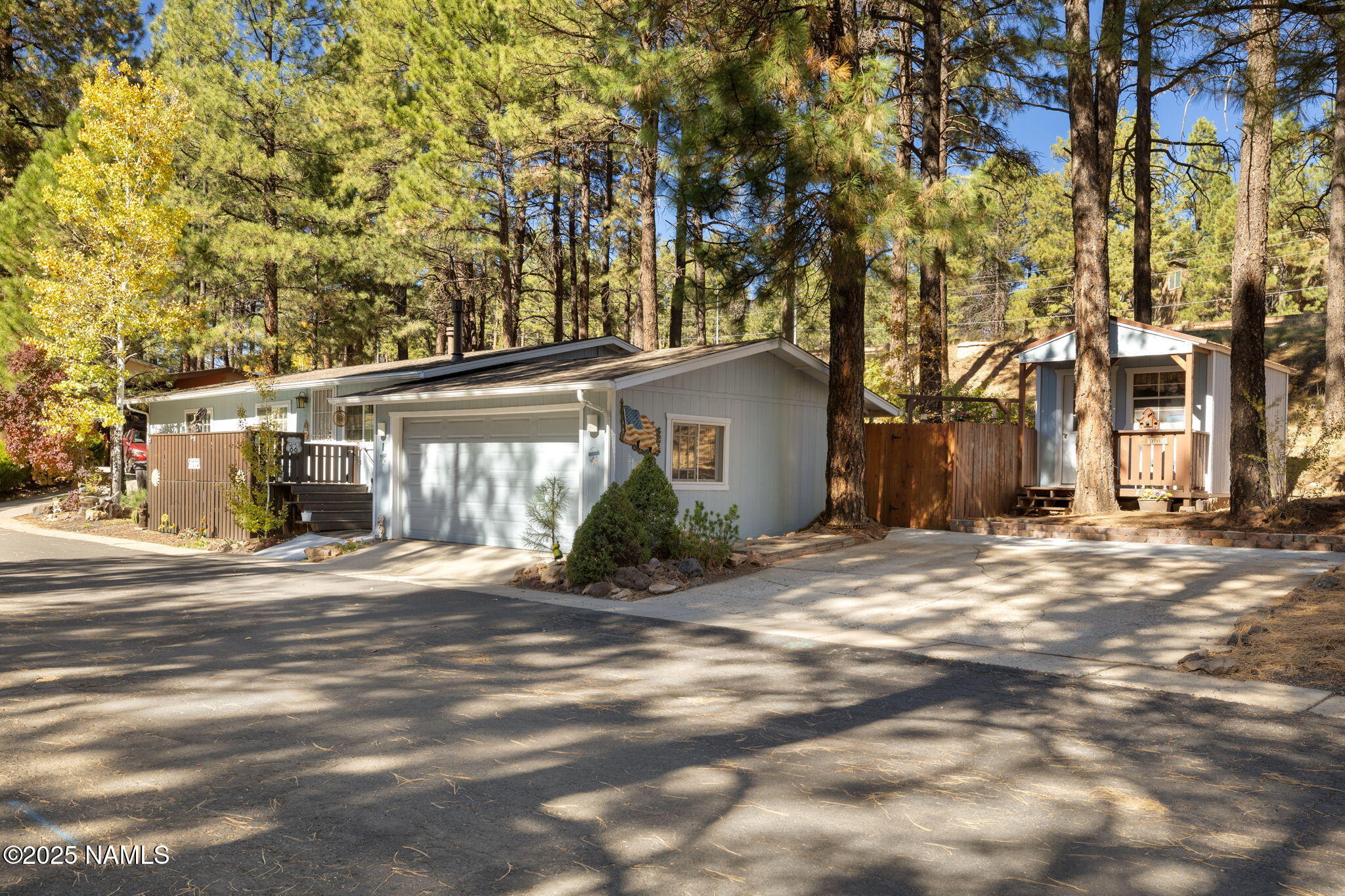 2401 West Rte 66 Flagstaff, AZ 86001 - Photo 45 of 47 a view of a house with backyard and tree s