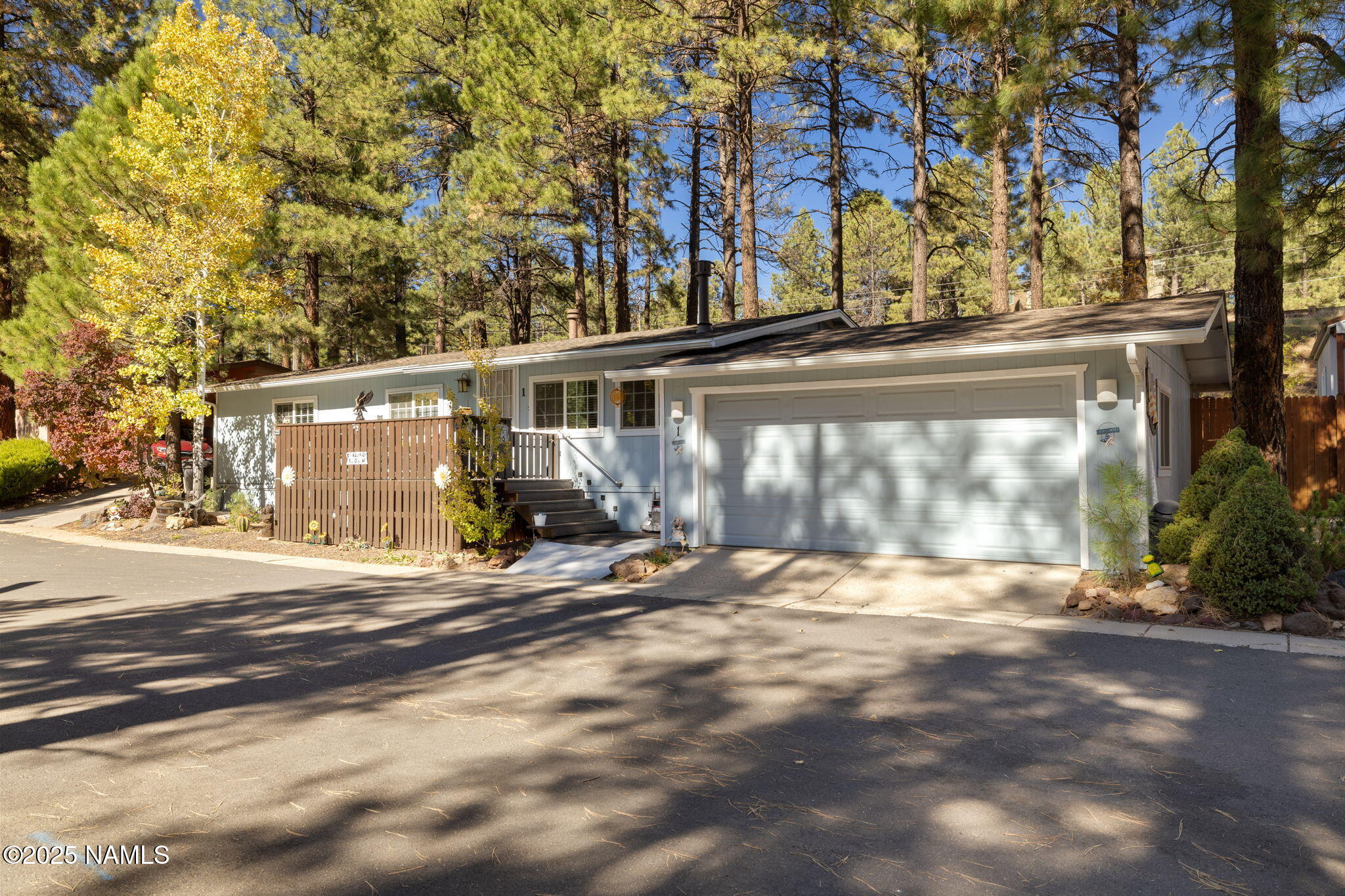 2401 West Rte 66 Flagstaff, AZ 86001 - Photo 46 of 47 a view of a house with a yard and garage