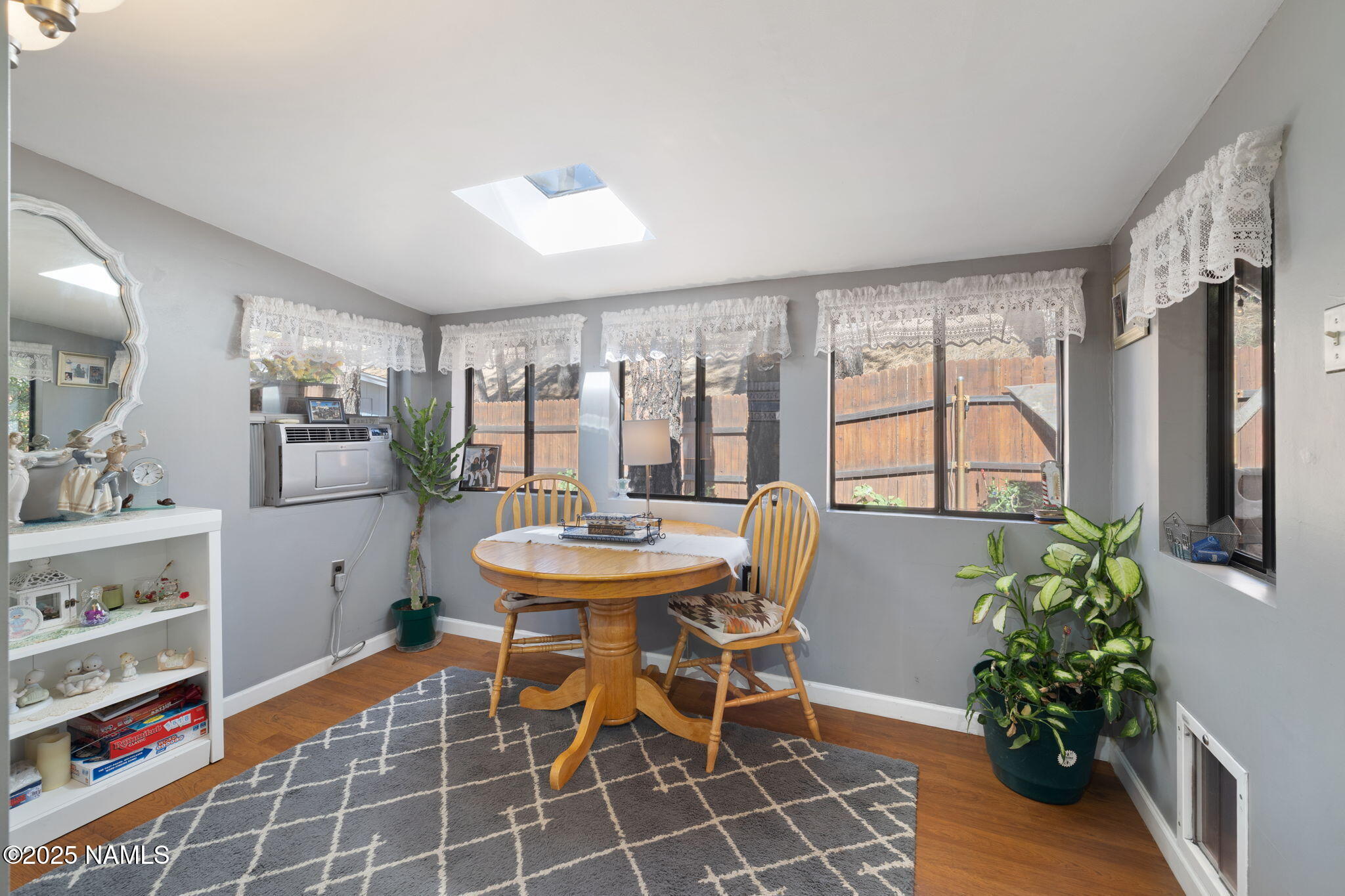 2401 West Rte 66 Flagstaff, AZ 86001 - Photo 8 of 47 a dining room filled chandelier and wooden floor