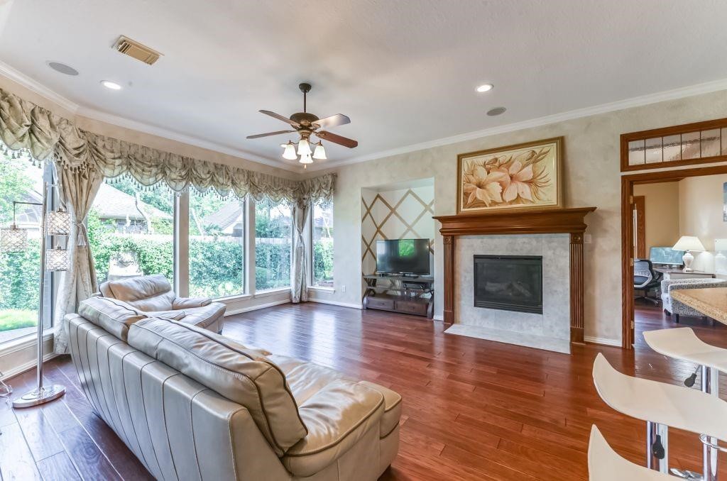 31 North Warbler Bend Circle Spring, TX 77382 - Photo 2 of 31 a living room with furniture and a fireplace