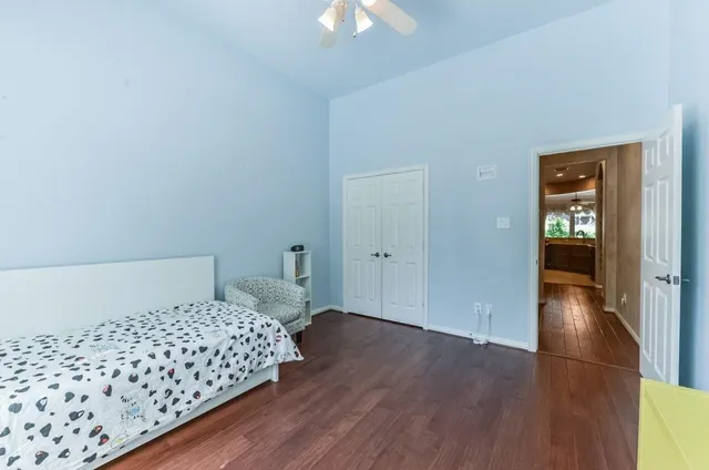 a bathroom with a sink a toilet a mirror and shower