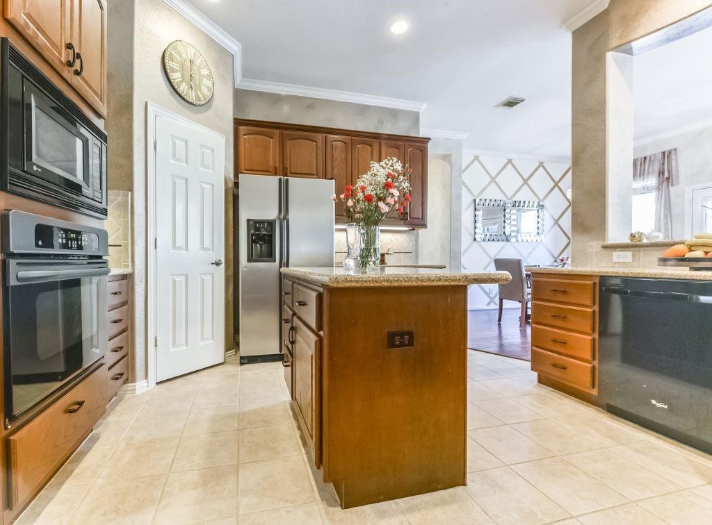31 North Warbler Bend Circle Spring, TX 77382 - Photo 10 of 31 a living room with stainless steel appliances granite countertop furniture a fireplace and a window