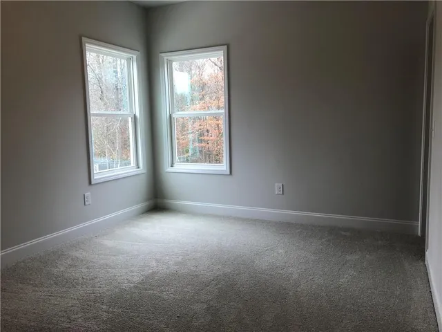 a bathroom with a bathtub and window
