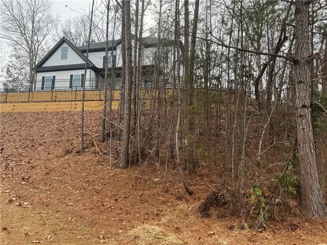 a house with trees in the background
