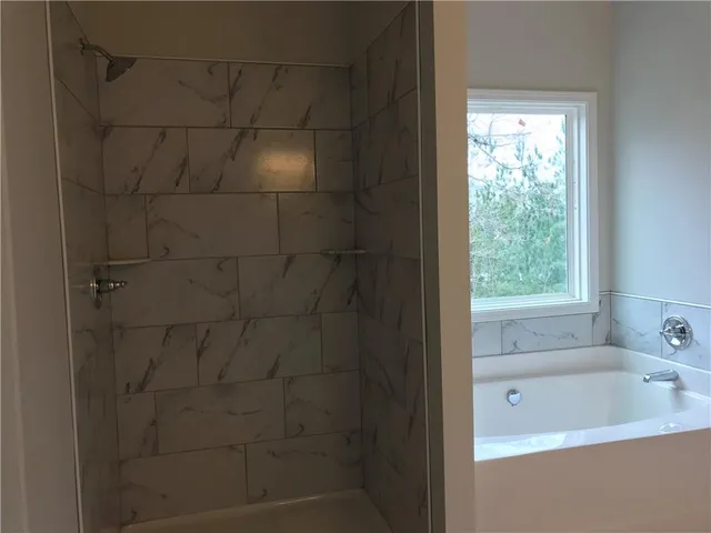 a kitchen with granite countertop a stove a sink and a microwave