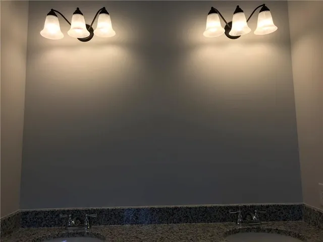 a bathroom with a light fixture and a light fixture