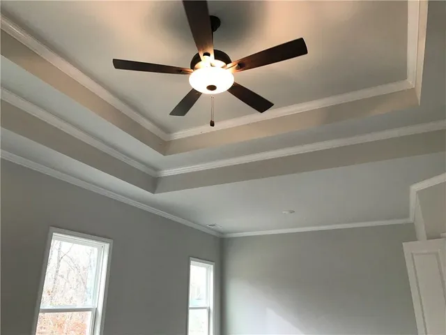 a view of a livingroom with wooden floor and a window
