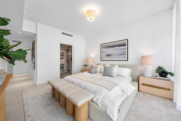 a bedroom with a bed and a couch