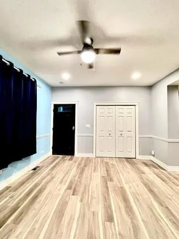 a bedroom with a bed and cabinets