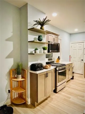 a kitchen with a stove and a microwave
