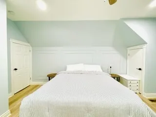 a bedroom with a bed and a closet