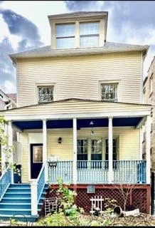 a front view of a house with a porch